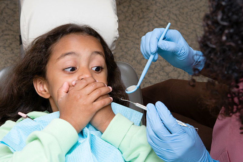 Child apprehensive about tooth loss at the dentist